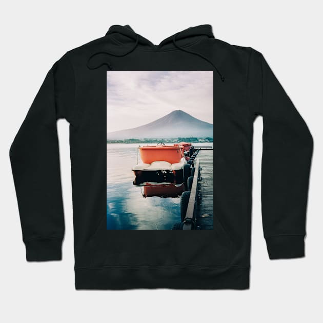 Paddleboats Tied to Wooden Pier in Early Morning Light Hoodie by visualspectrum